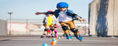 Portrait of preteen boy, inline skater in protective gear, practicing forward slalom at outdoor skate park